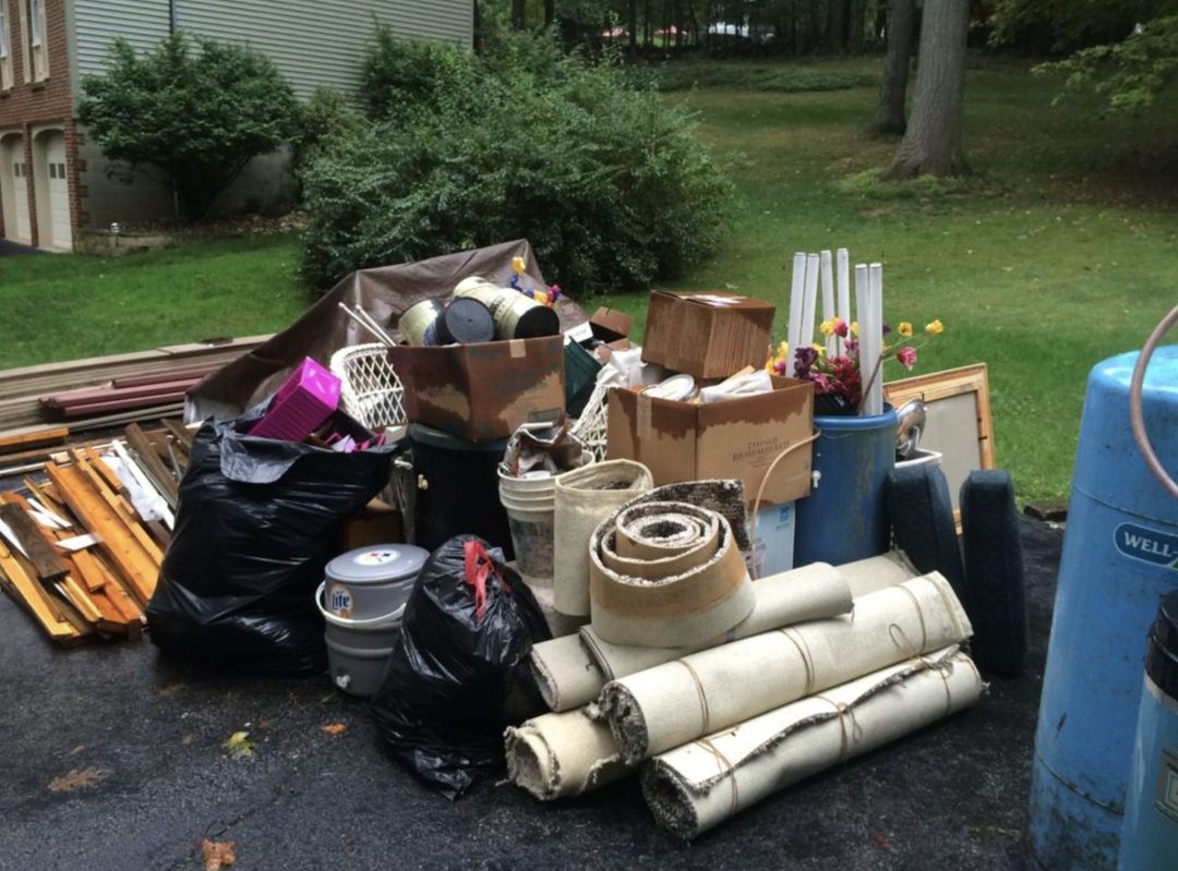 South Shore Junk Removal crew loading a haul